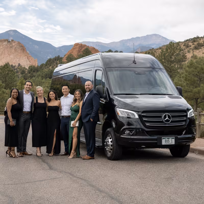 Group beside a Mercedes Sprinter limo from the Colorado Springs fleet