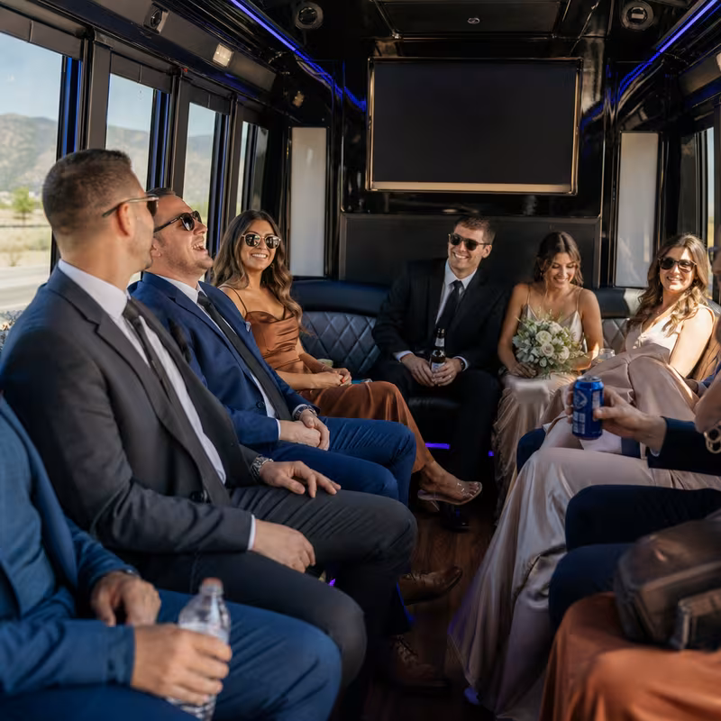 Wedding guests seated inside a Colorado Springs party bus