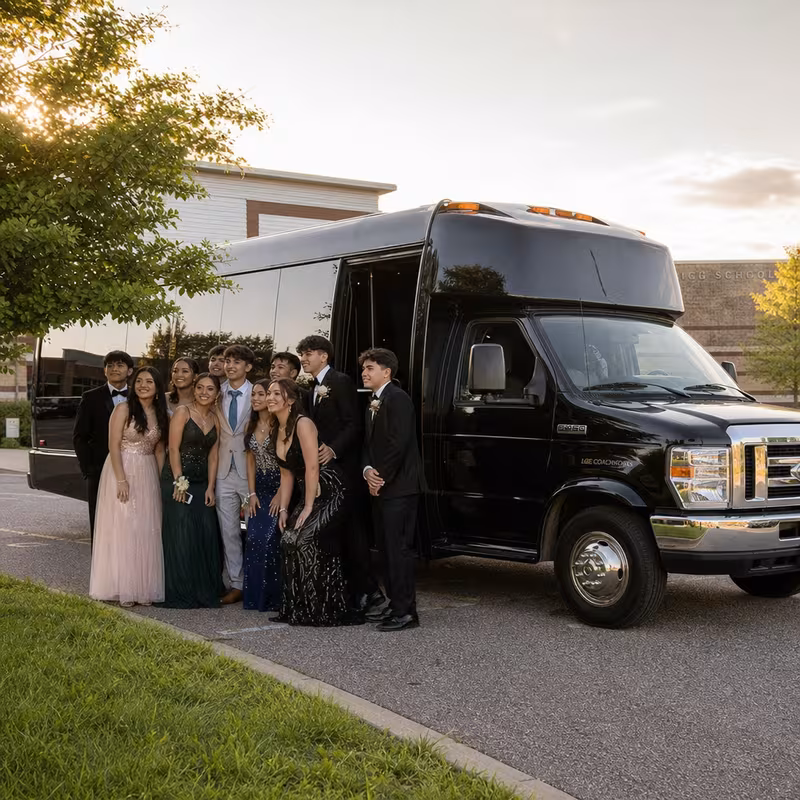 Group boarding a white charter bus for Prom & Homecoming Transportation transportation in Colorado Springs