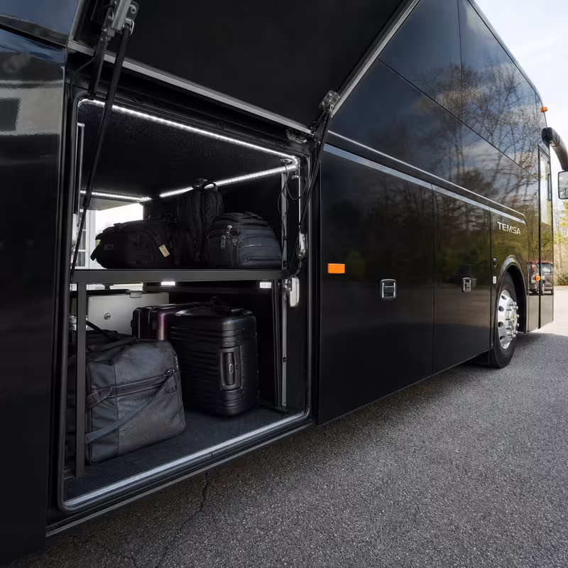 Party bus interior with wraparound leather seating and LED lighting in Colorado Springs