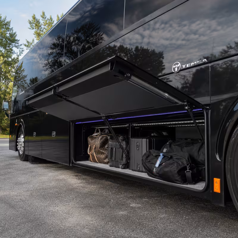 Party bus interior with wraparound leather seating and LED lighting in Colorado Springs