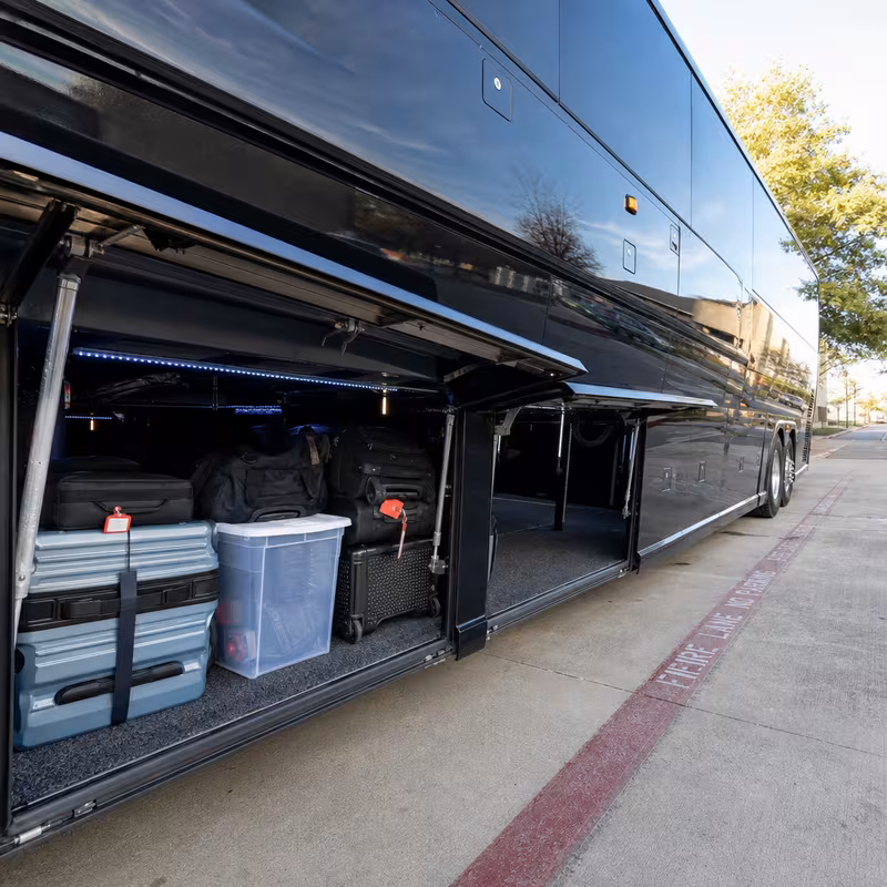 Party bus interior with wraparound leather seating and LED lighting in Colorado Springs